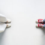 Friends standing with a space between themselves due to social distancing