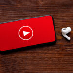 Video player icon on the screen of mobile phone and modern wirel