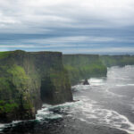 Beautiful view of the cliffs of Moher in Ireland on a gloomy day background