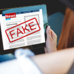 Young woman read fake news with tablet in hands sitting in car