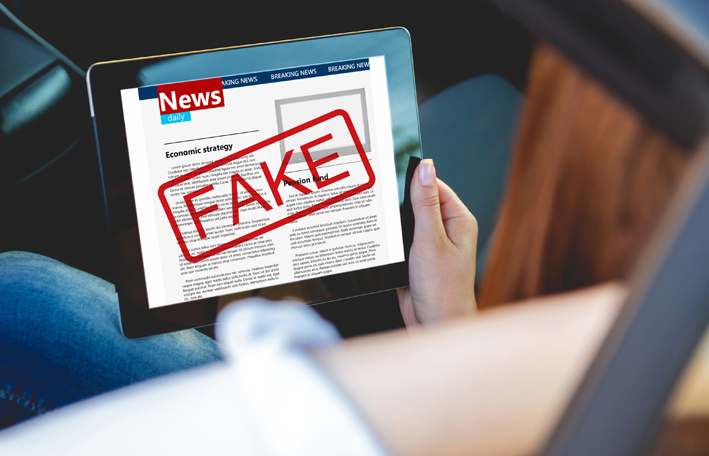 Illustrazione su fake news e verifica delle fonti online.