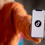 Wroclaw, Poland – 20 March 2021: woman holding iPhone 12 with Ti